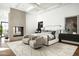 Stunning bedroom with a modern fireplace, stylish seating, and a luxurious bed at 6825 N 39Th Pl, Paradise Valley, AZ 85253