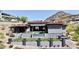 An expansive home exterior with a tiled roof, a pristine backyard pool, and desert landscaping at 6825 N 39Th Pl, Paradise Valley, AZ 85253