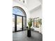 Grand foyer with soaring ceilings, arched window, and stylish decor at 6825 N 39Th Pl, Paradise Valley, AZ 85253
