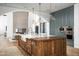 Gourmet kitchen features a large island, stainless steel appliances, and a custom range hood at 6825 N 39Th Pl, Paradise Valley, AZ 85253