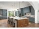 Gourmet kitchen with an island, marble countertops, and stainless steel appliances at 6825 N 39Th Pl, Paradise Valley, AZ 85253