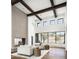 Inviting living area with a modern fireplace and a wall of windows with neighborhood views at 6825 N 39Th Pl, Paradise Valley, AZ 85253