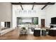 Bright living room featuring fireplace, wood flooring, and expansive windows with views at 6825 N 39Th Pl, Paradise Valley, AZ 85253