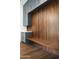 Mudroom with wood accent wall, built-in bench, and gray cabinets with stone countertops at 6825 N 39Th Pl, Paradise Valley, AZ 85253