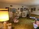 Living room with wood floors, vintage furniture, and large windows at 7043 E Ann Way, Scottsdale, AZ 85254