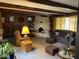 Living room with kiva fireplace, wood beams, and comfortable seating at 7043 E Ann Way, Scottsdale, AZ 85254