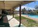 Relaxing pool area with covered patio and lush landscaping at 7043 E Ann Way, Scottsdale, AZ 85254