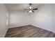 Spacious bedroom with ceiling fan and vinyl plank flooring at 7514 W Kristal Way, Glendale, AZ 85308