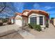 Single-story house with tile roof, attached garage, and well-maintained landscaping at 7514 W Kristal Way, Glendale, AZ 85308