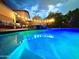 Illuminated pool at night, perfect for evening swims at 7567 W Andrea Dr, Peoria, AZ 85383