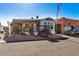 Mobile home with covered patio, shed, and golf cart at 8700 E University Dr # 737, Mesa, AZ 85207