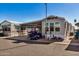 Mobile home with covered patio and golf cart at 8700 E University Dr # 737, Mesa, AZ 85207