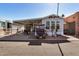 Mobile home with covered patio and golf cart at 8700 E University Dr # 737, Mesa, AZ 85207