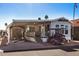 Mobile home with covered patio, shed, and golf cart at 8700 E University Dr # 737, Mesa, AZ 85207
