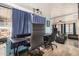 Spacious home office with two executive chairs and view into living area at 8700 E University Dr # 737, Mesa, AZ 85207