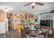 Kitchen with wood cabinets, island, and dining area view at 8700 E University Dr # 737, Mesa, AZ 85207
