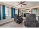 Relaxing living room with two recliners and a large flat-screen TV at 8700 E University Dr # 737, Mesa, AZ 85207