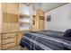 Main bedroom with built-in shelves and a mirrored closet at 8700 E University Dr # 737, Mesa, AZ 85207