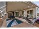 Covered patio with table, chairs, and shed at 8700 E University Dr # 737, Mesa, AZ 85207