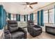 Sunroom features two recliners, a sofa, and a fireplace at 8700 E University Dr # 737, Mesa, AZ 85207