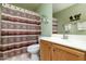 Guest bathroom with double vanity and shower at 8957 E Rainier Dr, Gold Canyon, AZ 85118