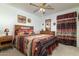 Guest bedroom with wooden furniture and southwestern bedding at 8957 E Rainier Dr, Gold Canyon, AZ 85118
