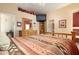 Main bedroom with mounted TV and built-in shelving at 8957 E Rainier Dr, Gold Canyon, AZ 85118