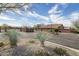 Attractive community entrance with landscaping and gated access at 8957 E Rainier Dr, Gold Canyon, AZ 85118
