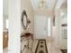 Bright entryway with tile flooring and a decorative console table at 8957 E Rainier Dr, Gold Canyon, AZ 85118