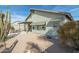 View of the home's exterior, highlighting the backyard and patio at 8957 E Rainier Dr, Gold Canyon, AZ 85118