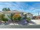 Single-story home with desert landscaping and a two-car driveway at 8957 E Rainier Dr, Gold Canyon, AZ 85118