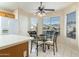 Kitchen nook with glass table and chairs, overlooking the neighborhood at 8957 E Rainier Dr, Gold Canyon, AZ 85118