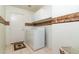 Laundry room with washer, dryer, and cabinets at 8957 E Rainier Dr, Gold Canyon, AZ 85118