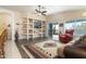 Bright living room with built-in shelving and a cozy sitting area at 8957 E Rainier Dr, Gold Canyon, AZ 85118