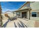 Patio with seating area and access to the interior of the home at 8957 E Rainier Dr, Gold Canyon, AZ 85118