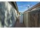 Side yard with storage shed and access gate at 8957 E Rainier Dr, Gold Canyon, AZ 85118