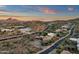 Wide angle aerial shot of desert neighborhood featuring mountain views and desert landscaping at 9815 N Copper Ridge Trl, Fountain Hills, AZ 85268