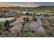 Overhead view showcasing desert home with a pool, patio and circular driveway, with desert landscaping at 9815 N Copper Ridge Trl, Fountain Hills, AZ 85268