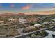 Aerial view of desert neighborhood at sunset with mountain views and desert landscaping at 9815 N Copper Ridge Trl, Fountain Hills, AZ 85268