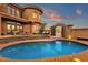 Luxury backyard featuring a swimming pool, spa, outdoor seating, and stone accents at 9815 N Copper Ridge Trl, Fountain Hills, AZ 85268