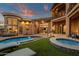 Luxurious backyard with pool, spa, lounge chairs, and lush landscaping for elegant outdoor living at 9815 N Copper Ridge Trl, Fountain Hills, AZ 85268