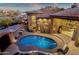 Aerial view of backyard with blue pool, covered patio, and desert landscaping at 9815 N Copper Ridge Trl, Fountain Hills, AZ 85268