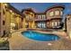 Wide shot of backyard featuring a pool, lounging area, and landscaped area at 9815 N Copper Ridge Trl, Fountain Hills, AZ 85268