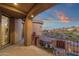 View of covered balcony with arched ceiling showing sunset sky and desert views at 9815 N Copper Ridge Trl, Fountain Hills, AZ 85268