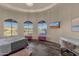 Spacious bedroom with a ceiling with recessed lighting, wood floors, and window with shutters at 9815 N Copper Ridge Trl, Fountain Hills, AZ 85268