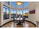 Bright breakfast nook with a round table set and large windows offering scenic views at 9815 N Copper Ridge Trl, Fountain Hills, AZ 85268