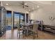 Dining room with a ceiling fan, table with seating for four, and access to the balcony at 9815 N Copper Ridge Trl, Fountain Hills, AZ 85268