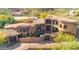 Stunning hillside home featuring beautiful tile roof, stone gate, and sparkling pool and spa at 9815 N Copper Ridge Trl, Fountain Hills, AZ 85268