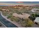 Sweeping shot showing a desert home with a terracotta roof and unique architectural details at 9815 N Copper Ridge Trl, Fountain Hills, AZ 85268