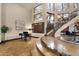 Spacious foyer with tile floors, staircase, piano, and tall windows providing natural light at 9815 N Copper Ridge Trl, Fountain Hills, AZ 85268